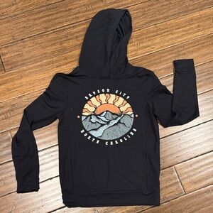 Black Hoodie with Mountain and Sun Graphic